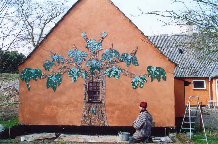 Tree mosaic on the side of Elatan's brother's house, made by both of them.